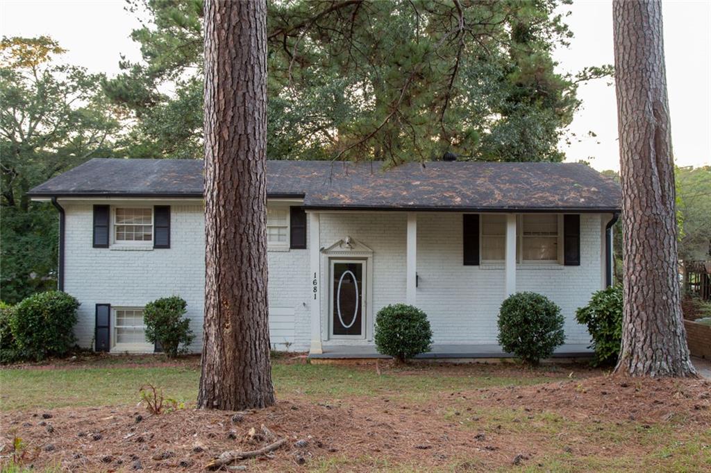 1681 Atherton Circle Decatur, GA 30035 - Photo 1 of 17 a view of a house with a tree and front view of a house