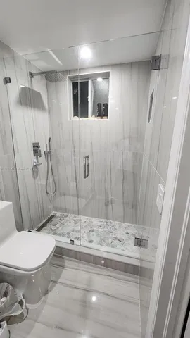 a bathroom with a bathtub and a sink