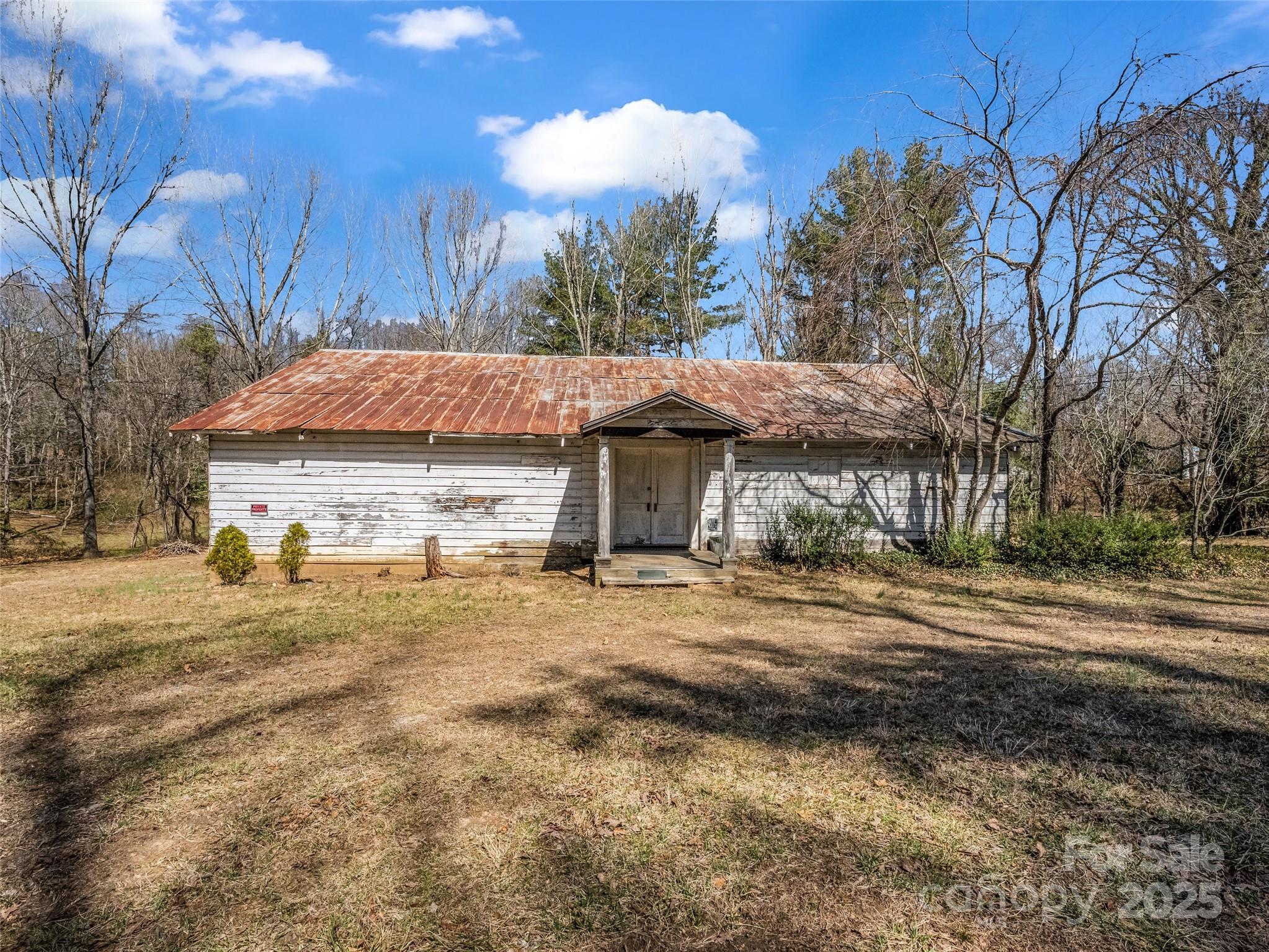 156 Warren Wilson Road Swannanoa, NC 28778 - Photo 5 of 38 a view of a house with a yard and large tree
