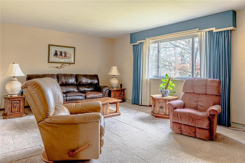 165 Old Glade Mill Road Valencia, PA 16059 - Photo 11 of 23 Living area with new neutral carpeting and oversized windows