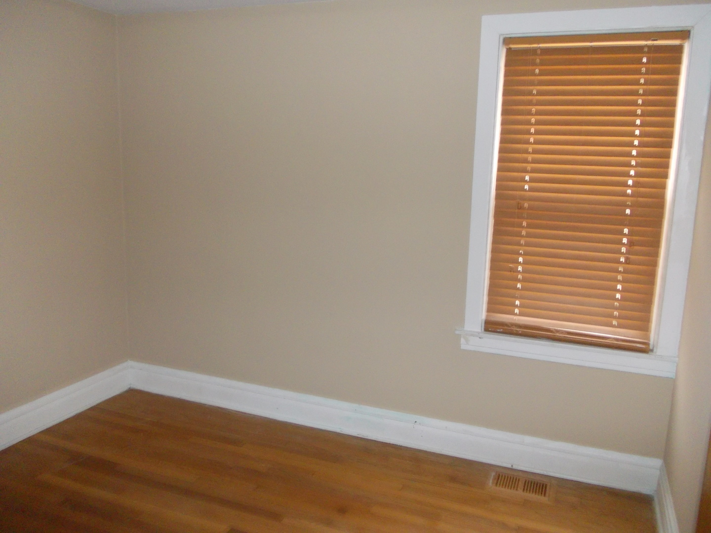 4145 Eberly Avenue Brookfield, IL 60513 - Photo 11 of 13 a view of an empty room with wooden floor and a window