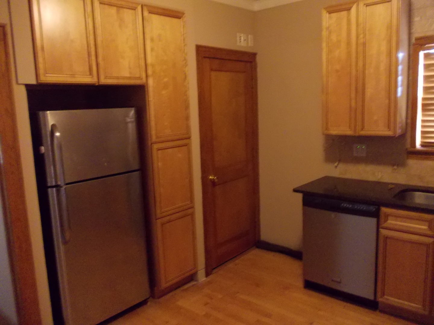4145 Eberly Avenue Brookfield, IL 60513 - Photo 4 of 13 a kitchen with a refrigerator and cabinets