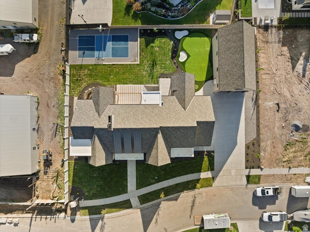478 South Maple Lakes Drive Mapleton, UT 84664 - Photo 50 of 51 Expansive property featuring a paved driveway, a multi-sport court with basketball hoops, a putting green, and a generously sized residence