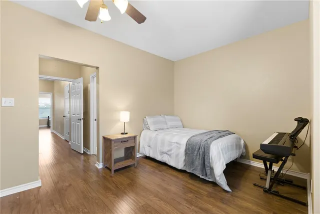 a bedroom with a bed and a chair