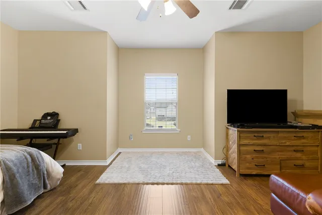 a view of a livingroom with furniture and a flat screen tv