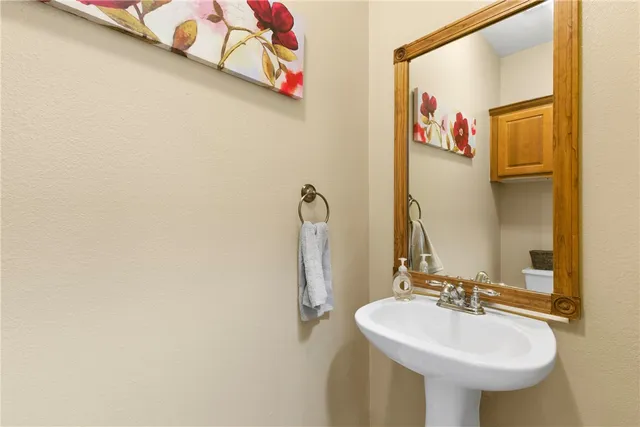 a bathroom with a sink and mirror