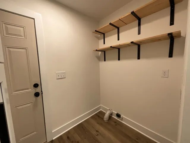 a view of storage and utility room with empty racks
