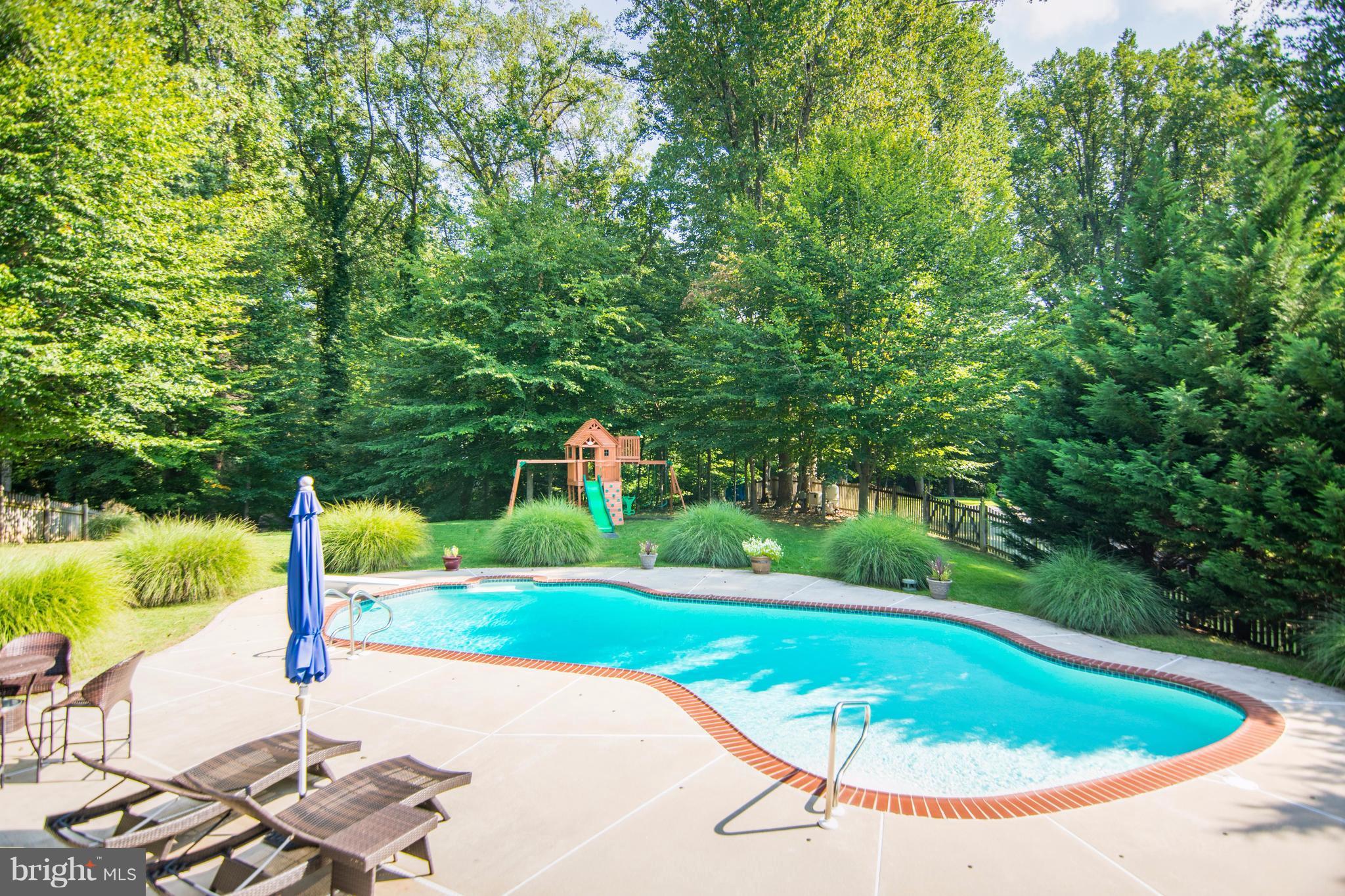 1569 Comanche Road Arnold, MD 21012 - Photo 22 of 22 Large yard with pool area and swing set