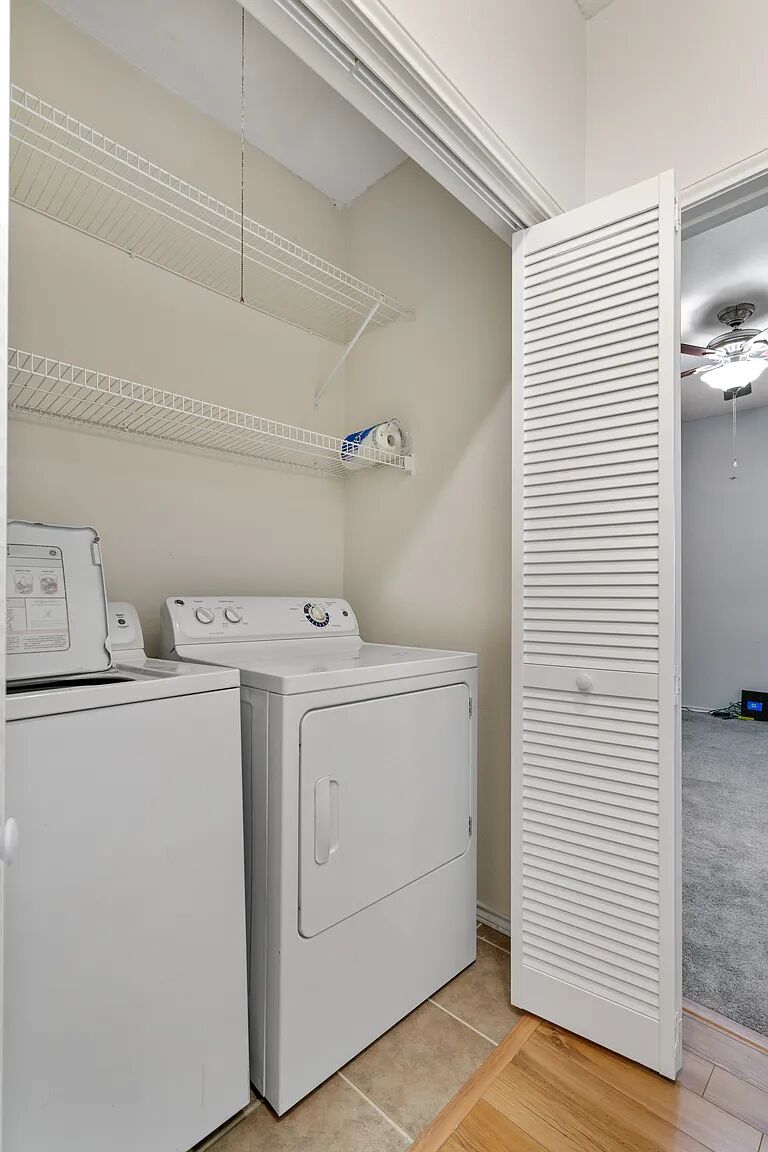 11970 Jollyville Road, Unit 202 Austin, TX 78759 - Photo 10 of 25 A dedicated laundry space provides practical storage and essential appliances.