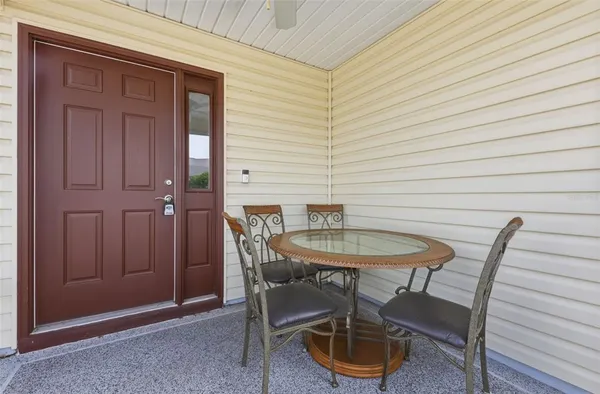 a view of a room that has a table and chairs in wooden floor