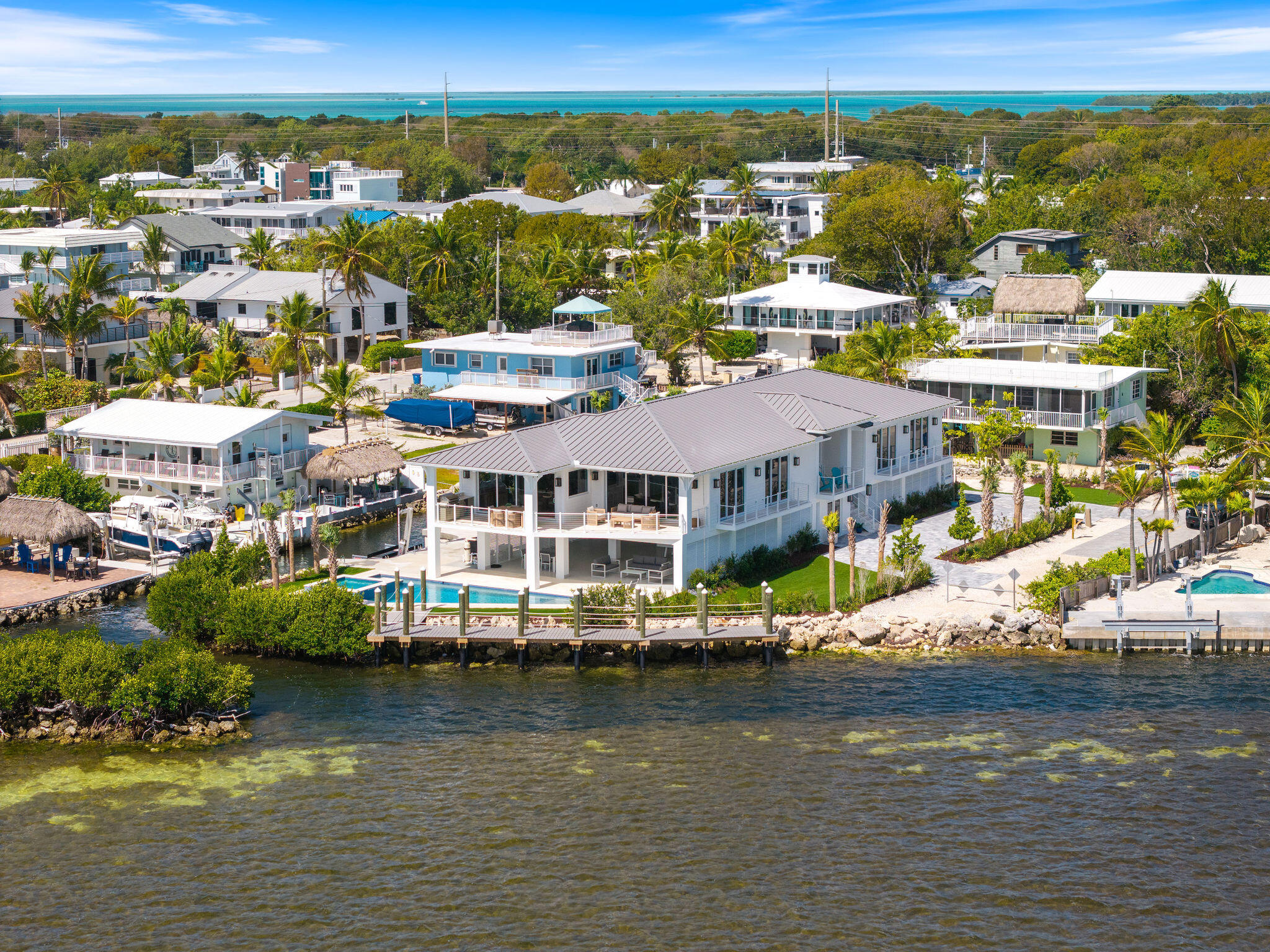 1002 Snapper Lane Key Largo, FL 33037 - Photo 104 of 106 a view of a lake with tall building in the background