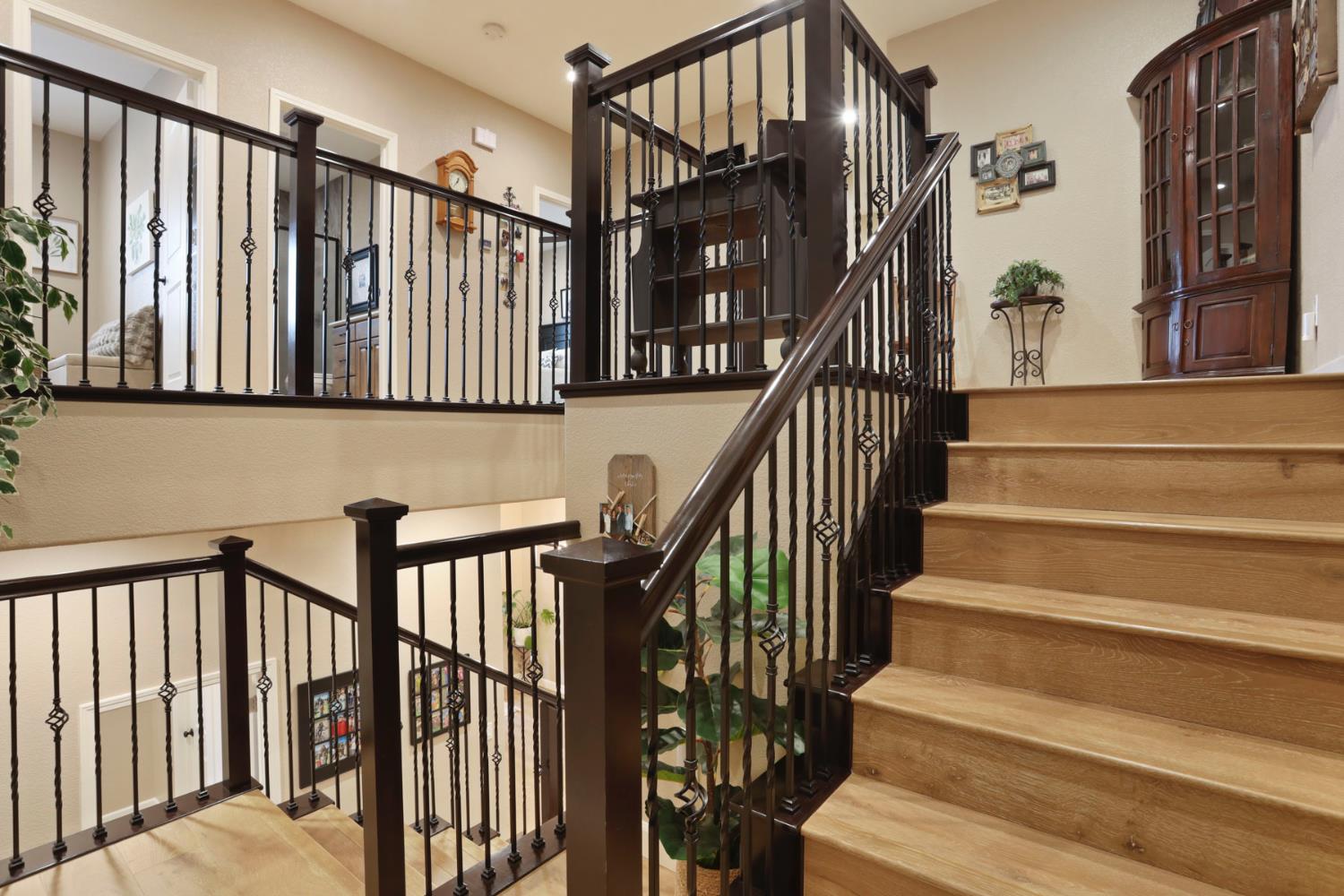 23346 Frederick Road Ripon, CA 95366 - Photo 35 of 96 a view of staircase with lots of frames on wall