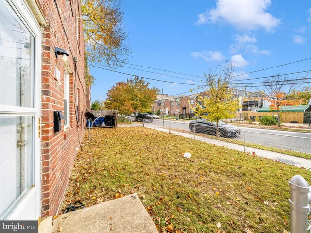 a view of a swimming pool with an outdoor seating