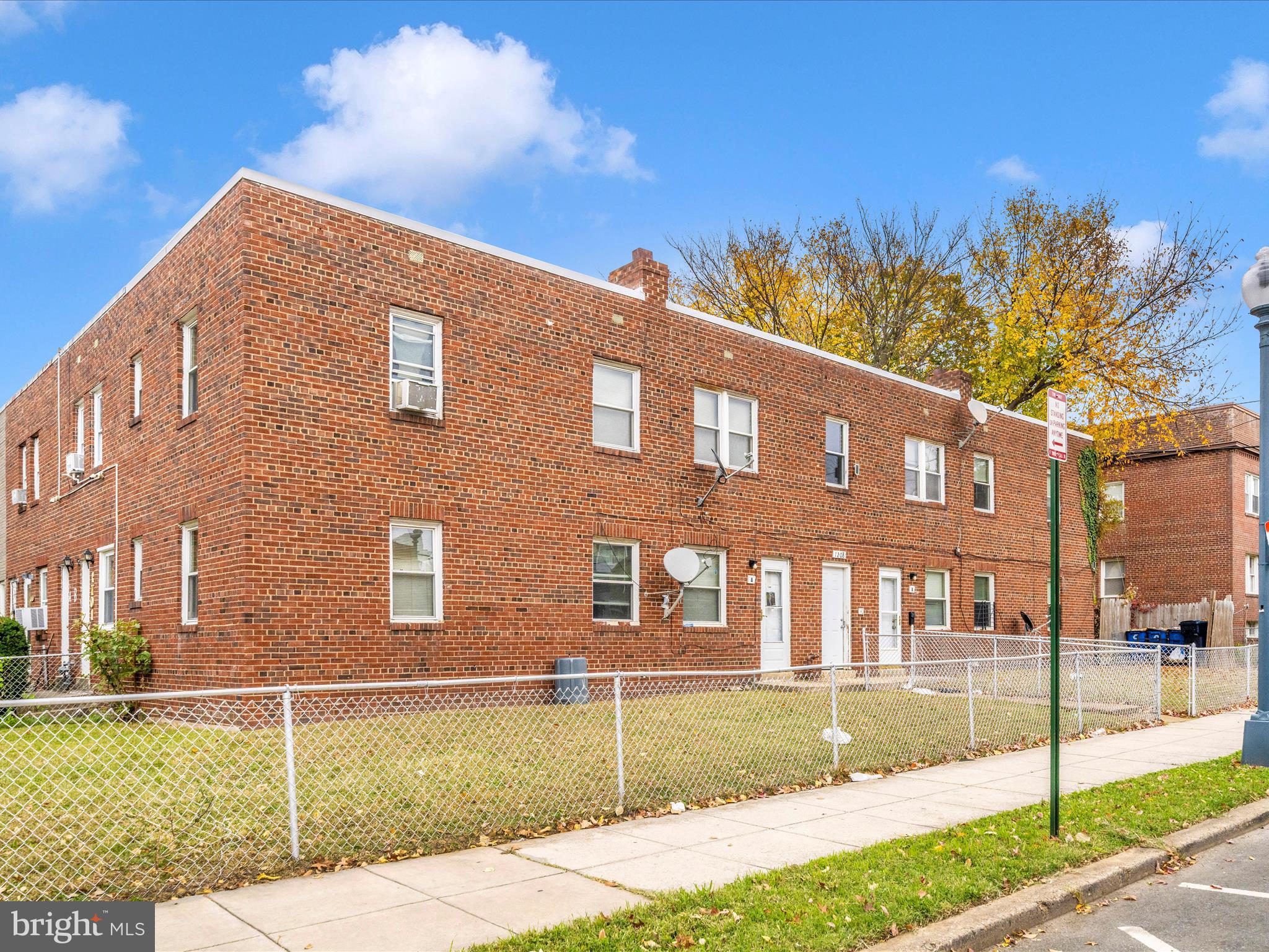 1208 Raum Street Northeast Washington, DC 20002 - Photo 2 of 15 a front view of a house with a yard