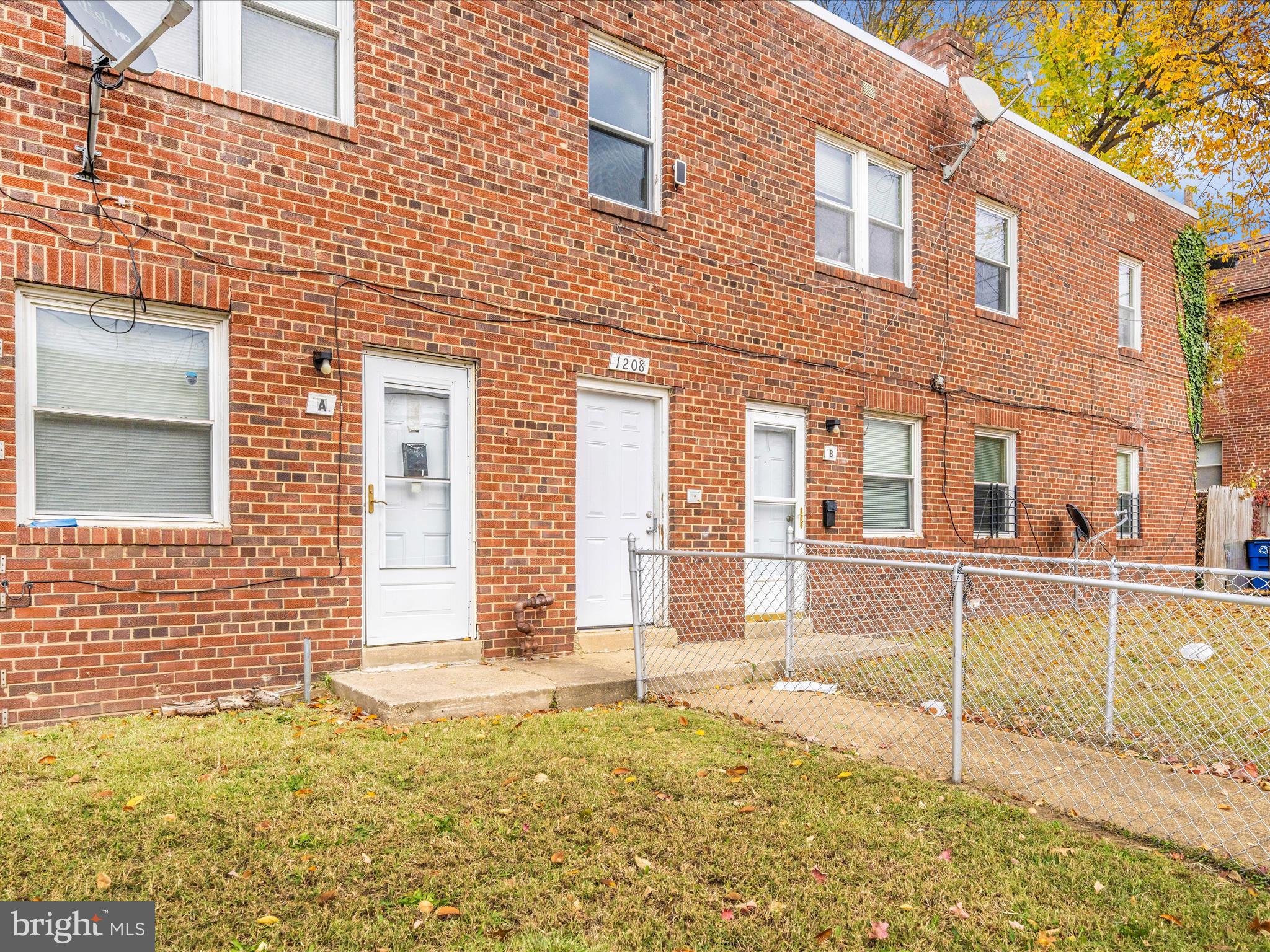1208 Raum Street Northeast Washington, DC 20002 - Photo 3 of 15 a view of a house with a backyard