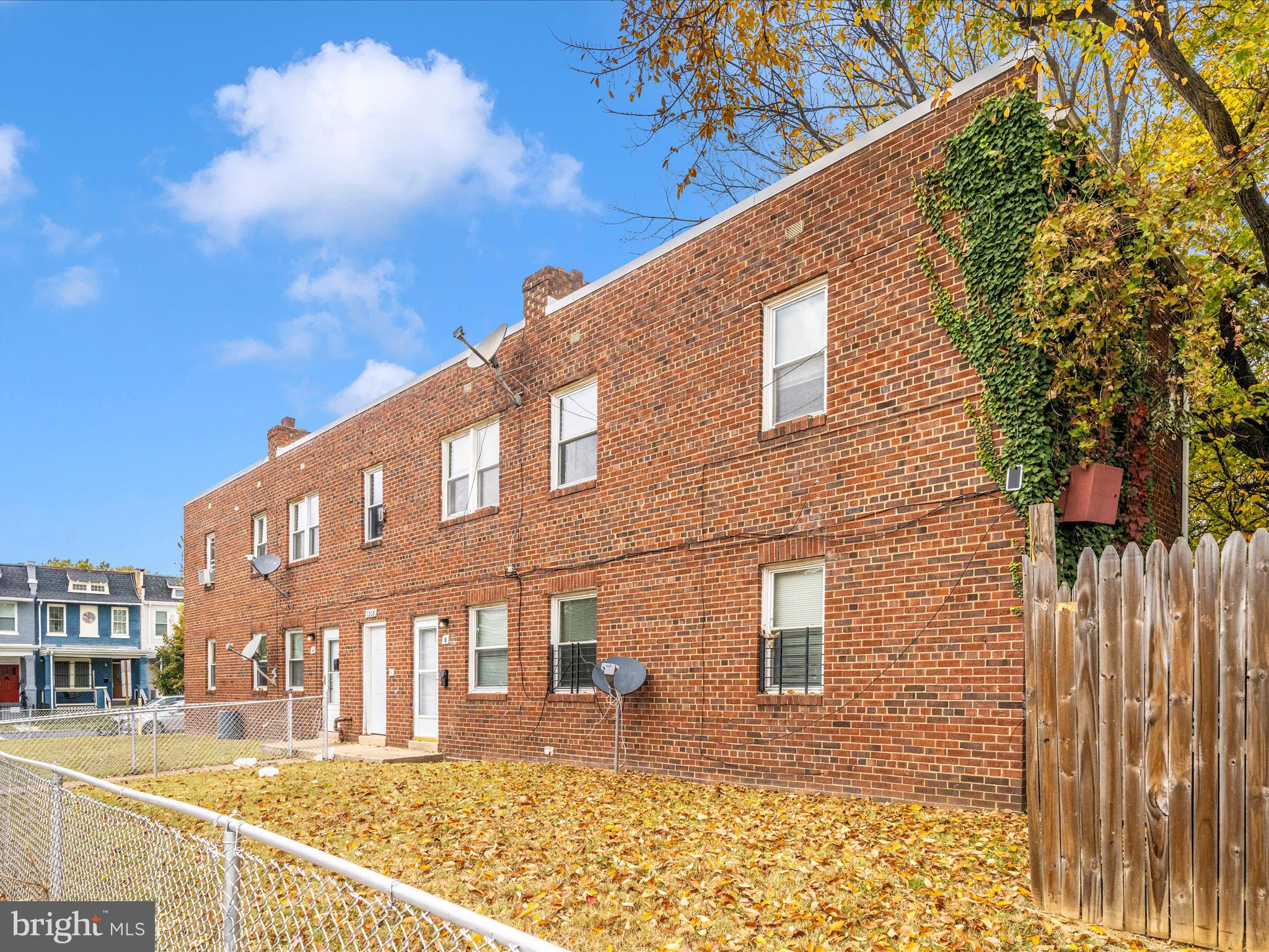 1208 Raum Street Northeast Washington, DC 20002 - Photo 6 of 15 a front view of a house with a yard