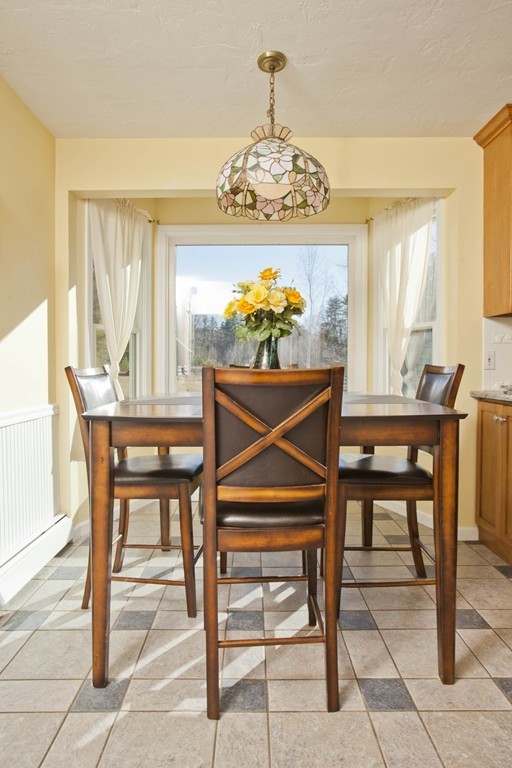51 Crest Road Monson, MA 01057 - Photo 11 of 30 a dining room with furniture and chandelier