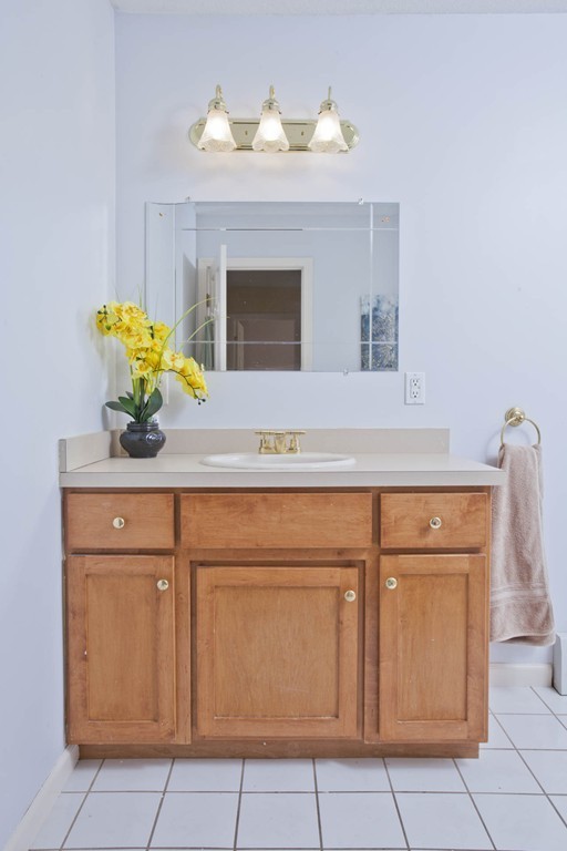 51 Crest Road Monson, MA 01057 - Photo 16 of 30 a sink with cabinets and wooden floor