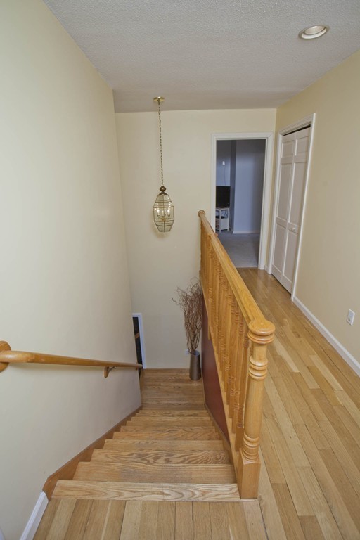 51 Crest Road Monson, MA 01057 - Photo 21 of 30 a view of a livingroom with wooden floor and stairs