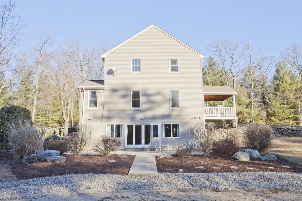 51 Crest Road Monson, MA 01057 - Photo 25 of 30 a view of a white house with a yard and large tree