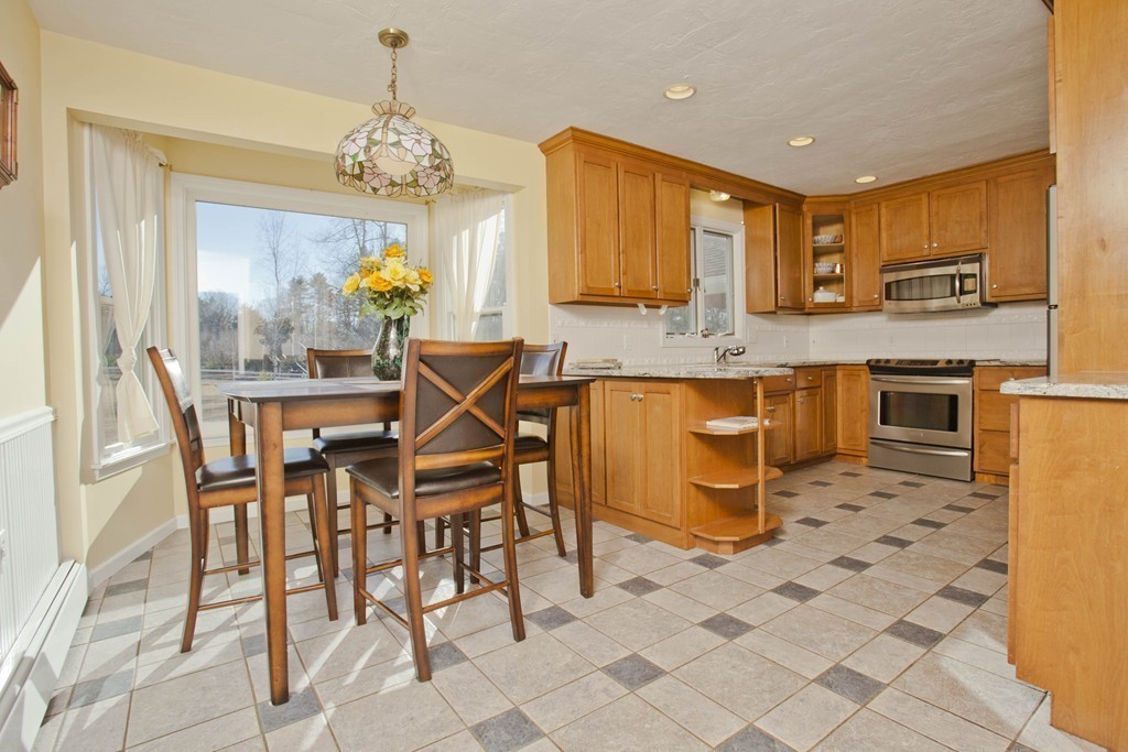 51 Crest Road Monson, MA 01057 - Photo 9 of 30 a kitchen with granite countertop a sink cabinets and stainless steel appliances