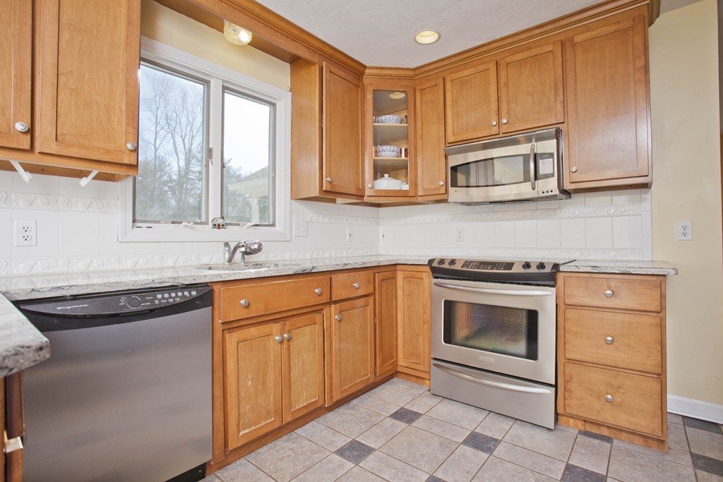 51 Crest Road Monson, MA 01057 - Photo 10 of 30 a kitchen with stainless steel appliances granite countertop a sink stove and cabinets