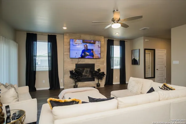 a living room with furniture and a flat screen tv