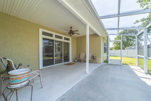 a view of a chairs and table in the balcony