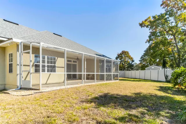 a view of a swimming pool with a house in the background