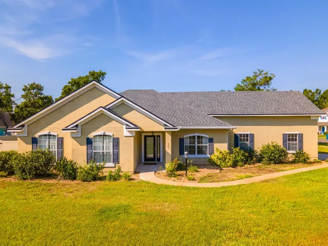 a front view of house and yard with swimming pool and outdoor seating