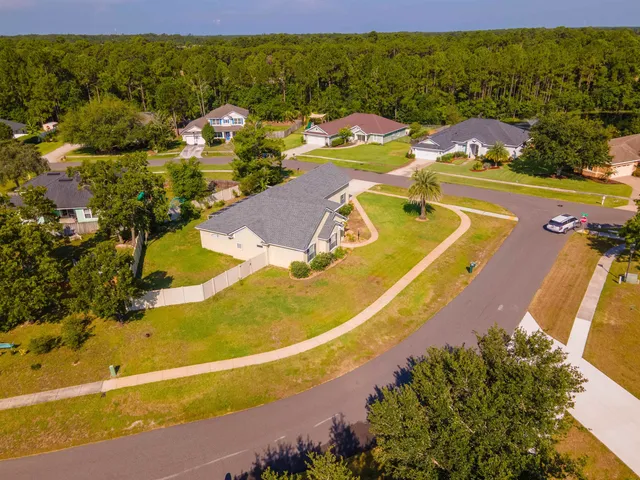 a view of a swimming pool with a lawn chairs