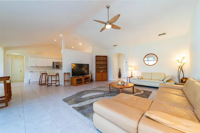 a living room with furniture and a table