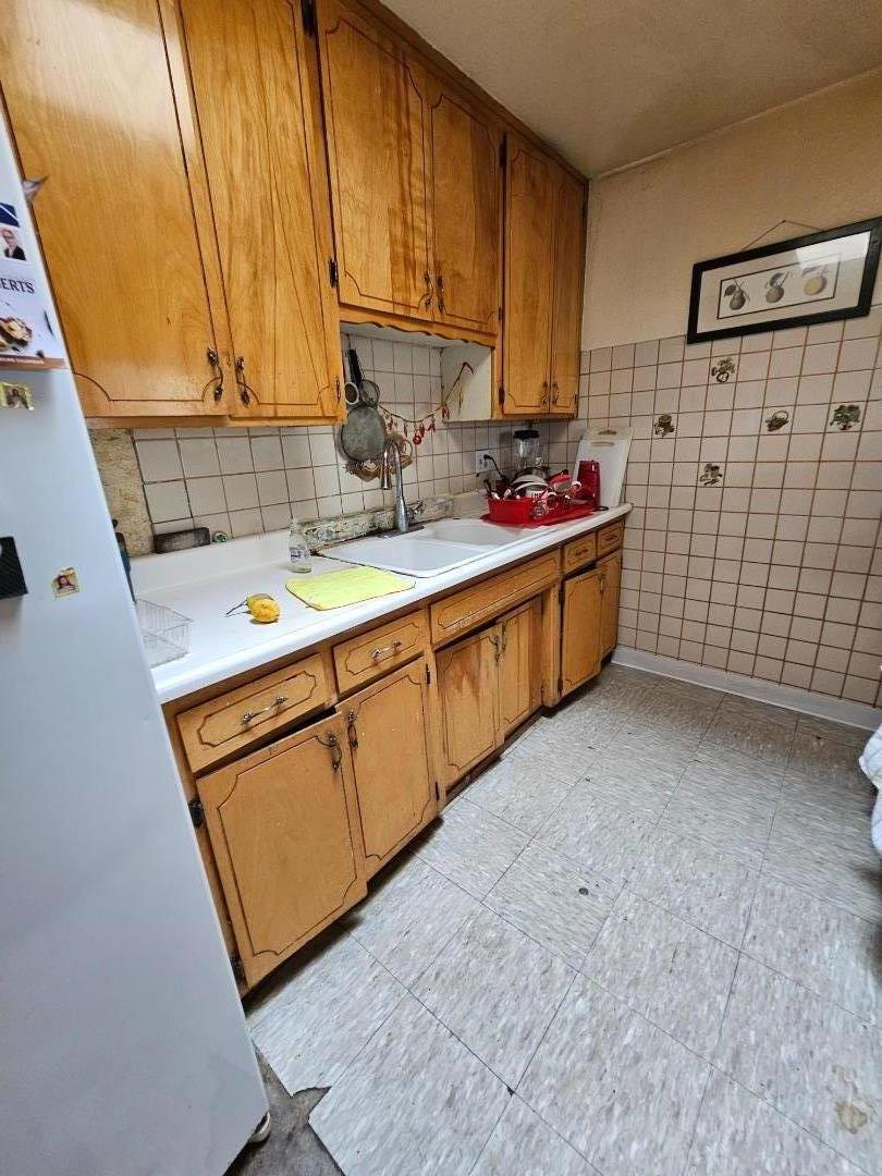 206 Montezuma Drive Soledad, CA 93960 - Photo 4 of 8 a kitchen with a sink cabinets and window