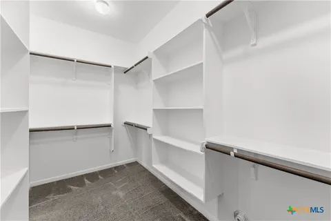 a view of an empty walk in closet