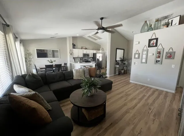 a living room with furniture and a large window