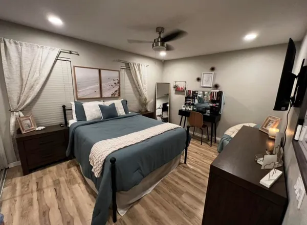 a bed room with a bed and furniture