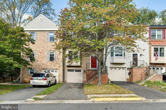 a view of a street that has a car parked on the side of it
