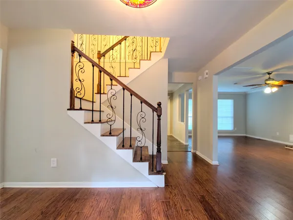 a view of an entryway with wooden floor