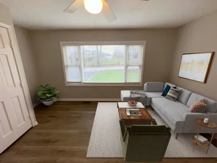 a living room with furniture and a window