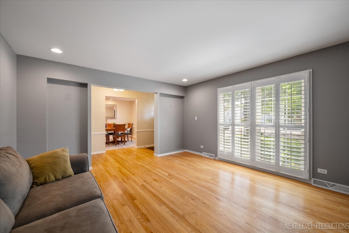 1009 East Bailey Road Naperville, IL 60565 - Photo 5 of 33 a spacious bedroom with a large bed and a large window