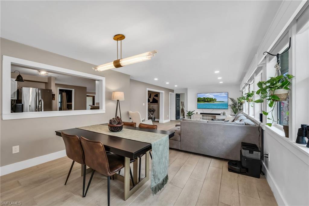 1840 23rd Street Southwest Naples, FL 34117 - Photo 21 of 50 Dining area featuring pendant light, recessed lighting and wood plank porcelain tile flooring