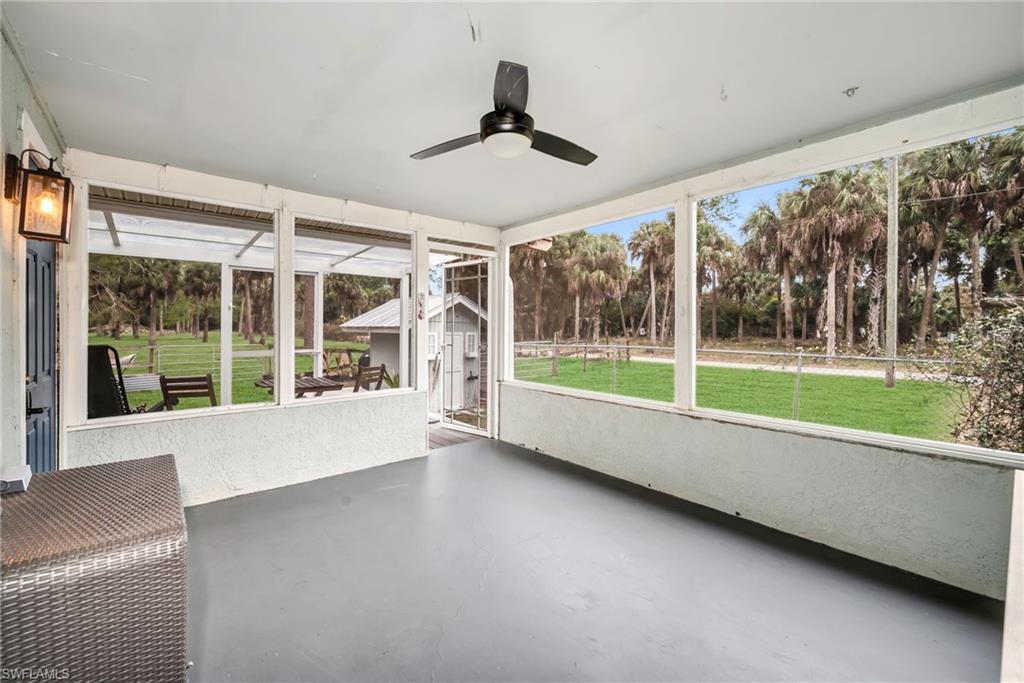 1840 23rd Street Southwest Naples, FL 34117 - Photo 35 of 50 Screened in sunroom with a ceiling fan