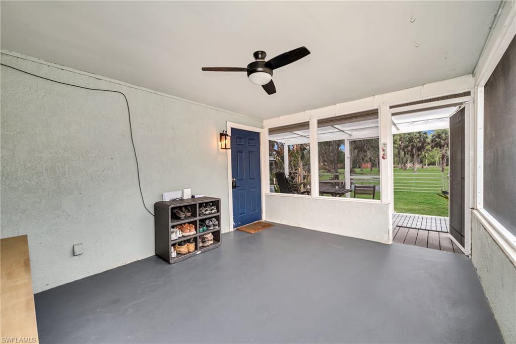 1840 23rd Street Southwest Naples, FL 34117 - Photo 36 of 50 Screened in sunroom with a ceiling fan