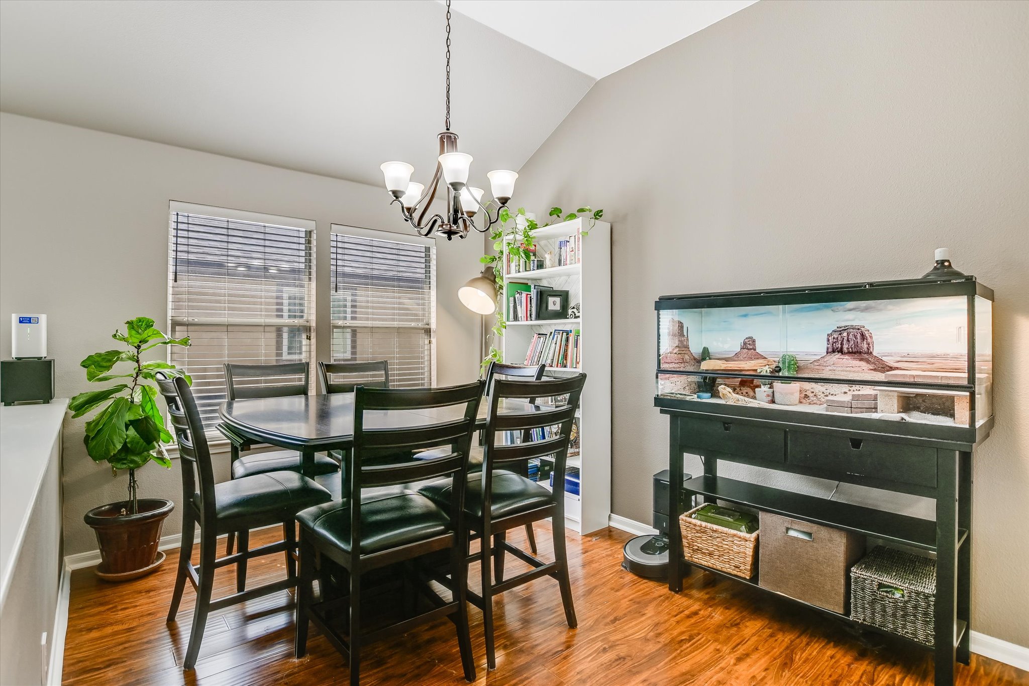 1302 Redbud Lane Leander, TX 78641 - Photo 4 of 28 a view of a dining room with furniture wooden floor and chandelier