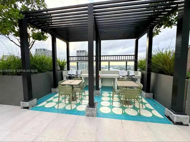 a view of a patio with a table chairs and a patio