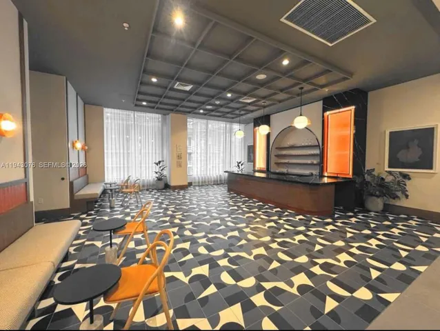 a view of a hall with a couch