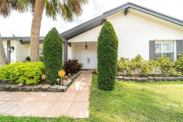 a front view of a house having yard