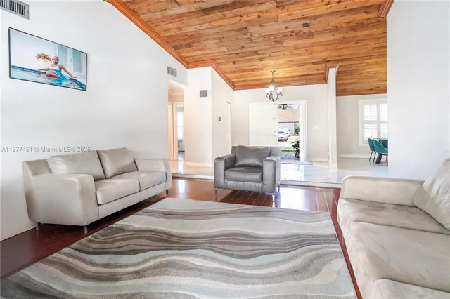 a bedroom with furniture and a large window