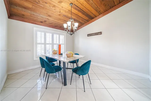 a view of a dining room with furniture and window