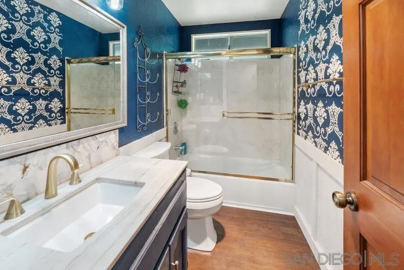 14578 Rios Canyon Road El Cajon, CA 92021 - Photo 34 of 61 a bathroom with a sink toilet and shower